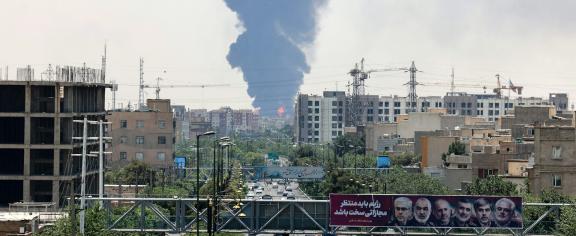Heavy smoke and fire rise from an oil refinery in southern Tehran
